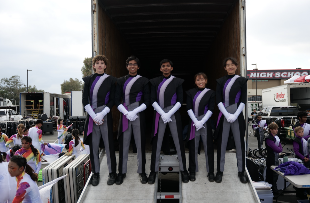 Vardaan Singhina ('25) stands with his fellow band leaders in front of the truck, ready to perform their show.